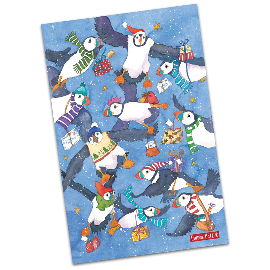 Christmas Flying Puffins Tea Towel by Emma Ball.