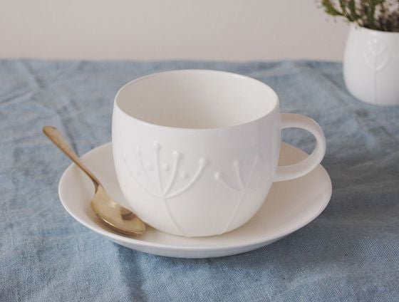 Repeat Repeat's White Bone China Plum Sprig Teacup & Saucer. Made in England.