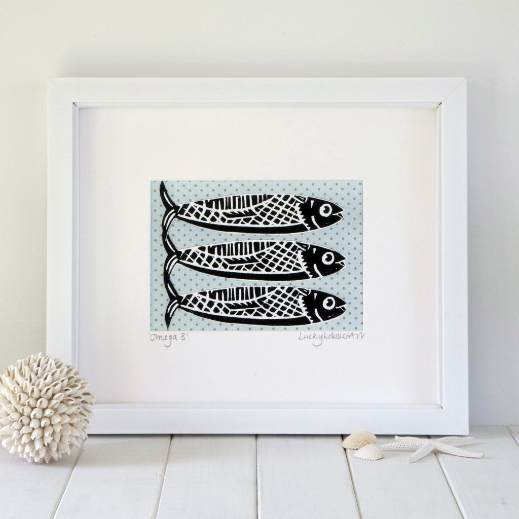 Framed Omega Fish print taken from the original lino print artwork from Lucky Lobster Art in England.