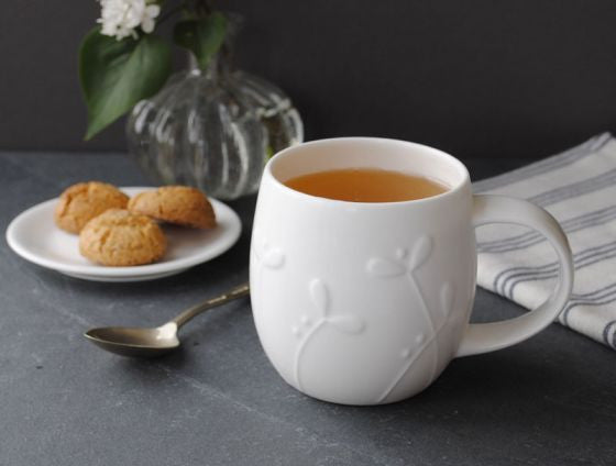 Repeat Repeat's White Bone China Plum Cress mug. Made in England.