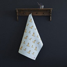 Organic cotton tea towel covered in yellow labradors from Sweet William Designs.