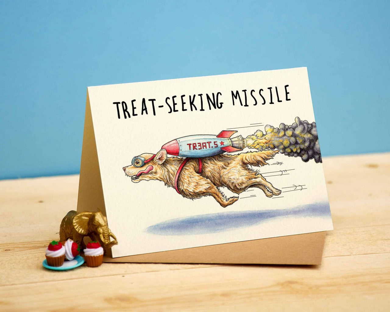 Treat-Seeking Missile Greetings Card by Bewilderbeest.