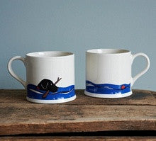 Black lab swimming pottery mug from Sweet William Designs.