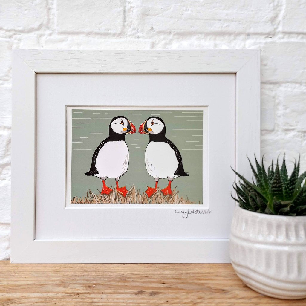 Two Cheeky Puffins framed print taken from the original lino print artwork from Lucky Lobster Art.