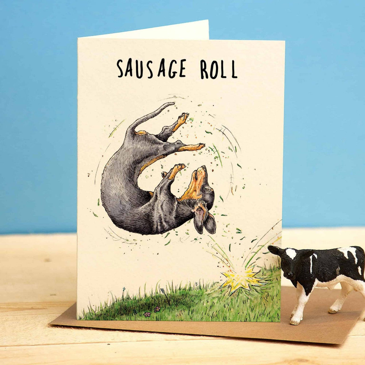 Sausage Roll Greetings Card by Bewilderbeest.