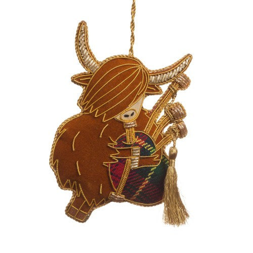 Bagpiping Highland Cow Decoration by St. Nicolas.