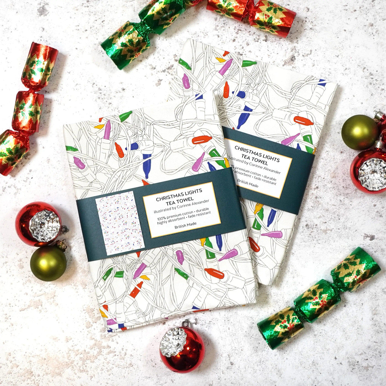 Christmas Lights Tea Towel by Corinne Alexander.