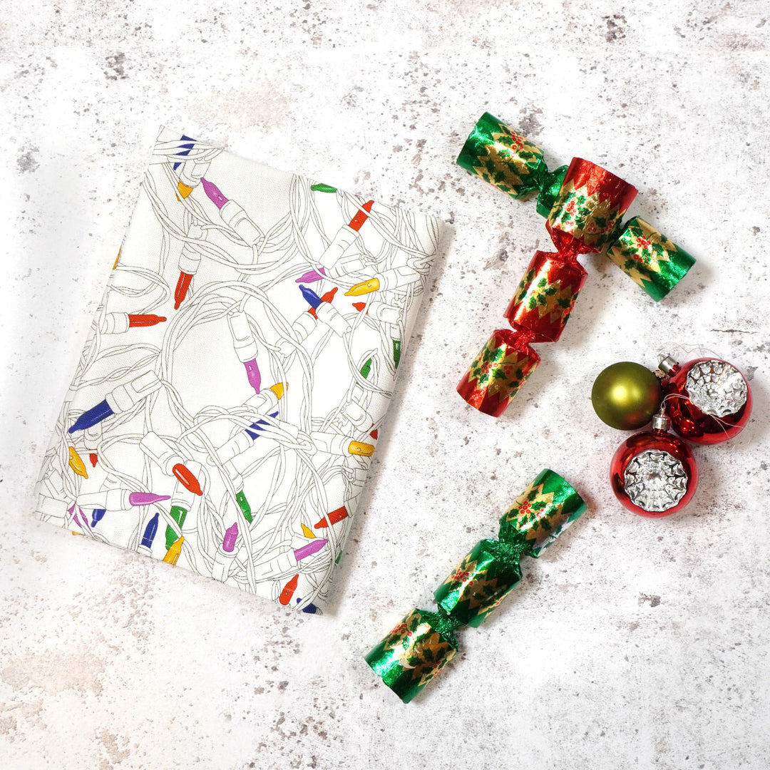 Christmas Lights Tea Towel by Corinne Alexander.