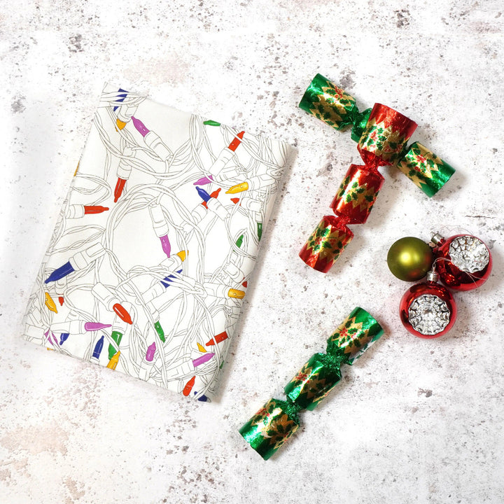 Christmas Lights Tea Towel by Corinne Alexander.
