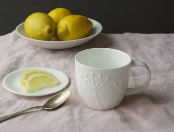 Repeat Repeat's White Bone China Olive Sprig mug. Made in England.