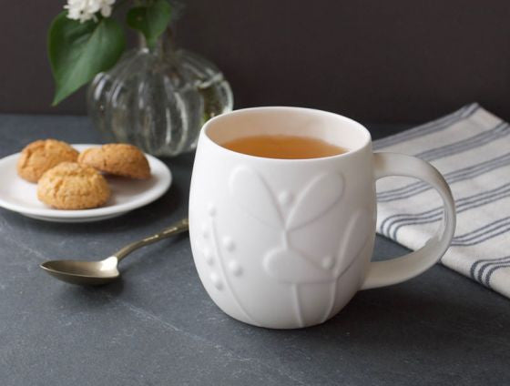 Repeat Repeat's White Bone China Plum Seedling mug. Made in England.