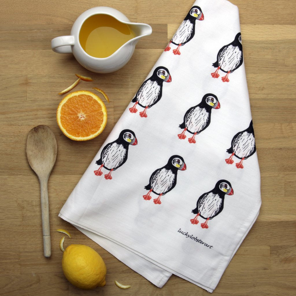 Puffin tea towel with design from the original lino print artwork from Lucky Lobster Art in England.